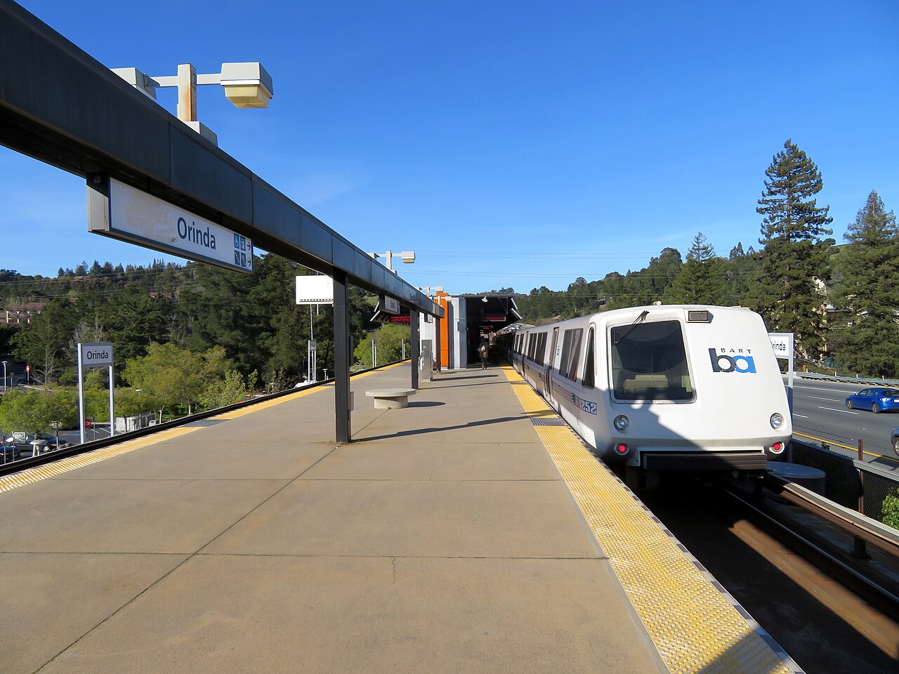 A BART train stopped at the elevated platform of Orinda station.