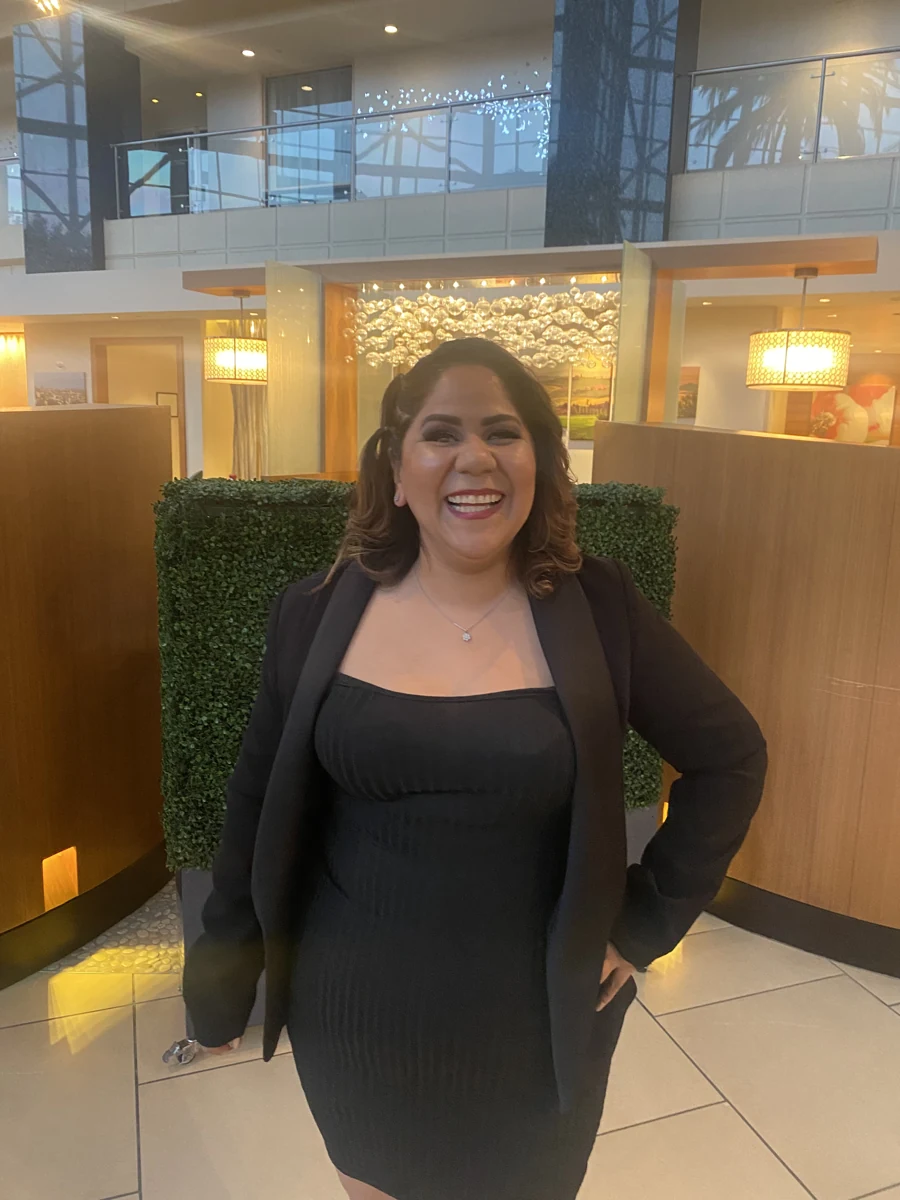 Juanita Herrera smiling in a black blazer.