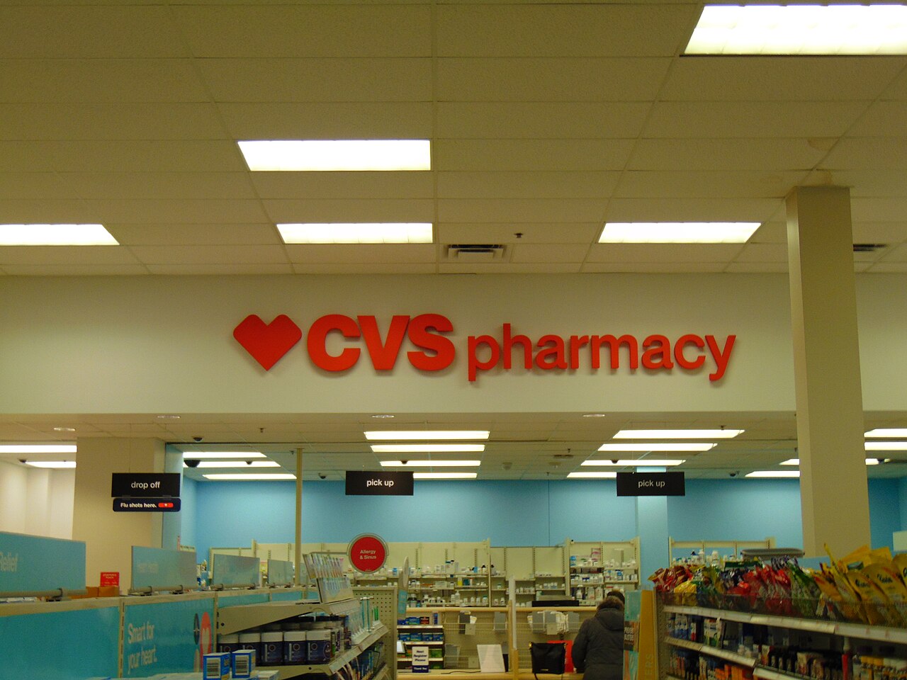 Inside a Target store, with the pharmacy counter and store signage visible.